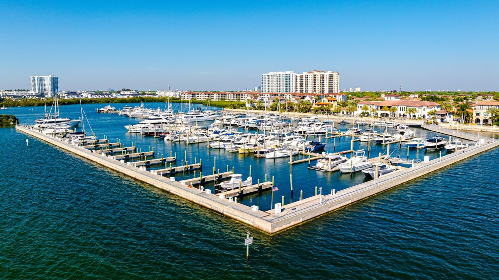 AQUA at Westshore Yacht Club seen from Tampa Bay, with the Westshore Marina District in the background